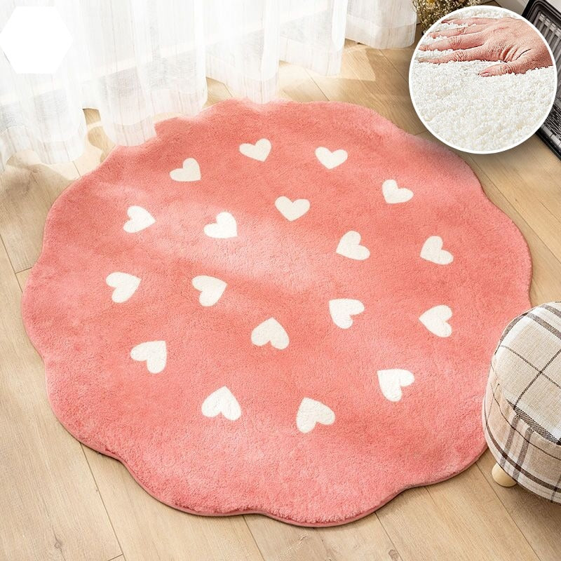 Tapis rond rose avec des coeurs